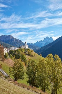 View of the church Chiesa di Colle Santa Lucia in Santa Lucia in autumn