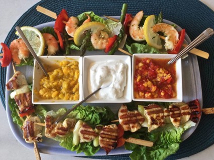 Salad plate with dip bowls Prawn skewers