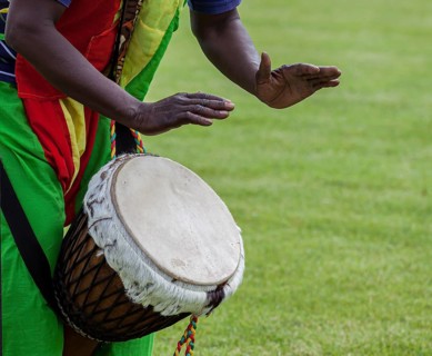 Musicians playing on an African djembe