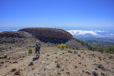 Hiker and in the background view to El Sombrero de Chasna