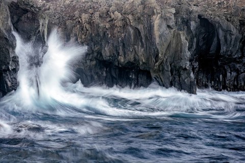 Surf at rocky lava coast