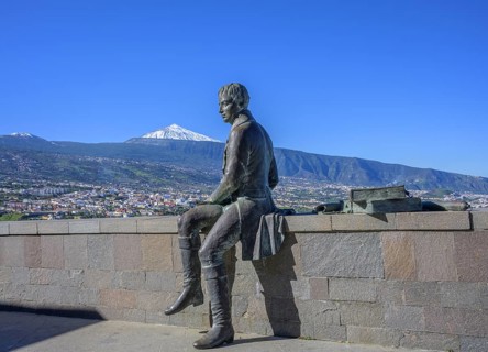 Statue of Humboldt behind the snow-capped Teide