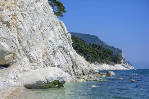 High rocks at the end of the beach Spiaggia del Frate