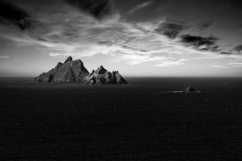 Two rocky islands in the sea at sunset