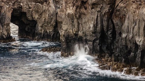 Surf at rocky lava coast