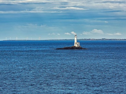 Tuskar Rock Lighthouse on small rocky island