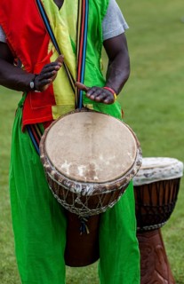 Musicians playing on an African djembe