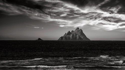 Two rocky islands in the sea at sunset
