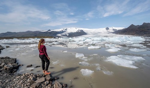 Woman in front of Fjallsarlon ice lagoon