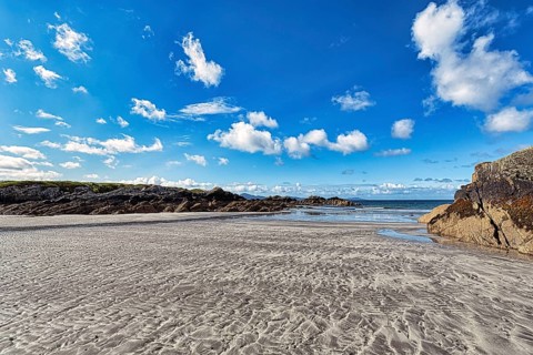 Sandy beach beach in bay at low tide
