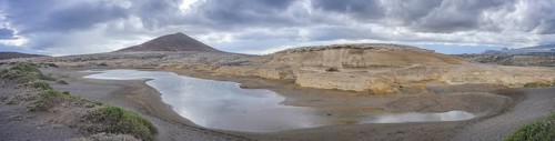 Sandstone structures and behind them the mountain Montana Roja