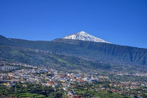 View over the town to the snow-capped Teide