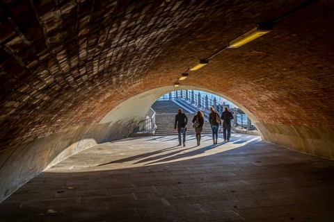 Passers-by cross a subway at the Schlossbruecke in Berlin-Mitte