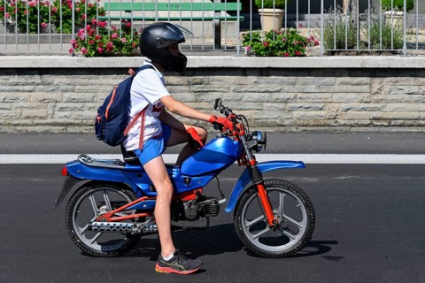 Teenager with tuned moped