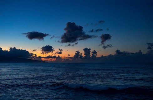 Sunset with clouds on the beach of Praia de Santa Barbara