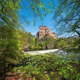 Kriebstein castle near Mittweida framed by beech trees in spring