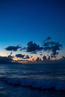 Sunset with clouds on the beach of Praia de Santa Barbara