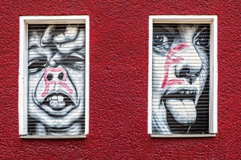 Creative graffiti with emotional statements on the facade of a youth psychiatrist's house