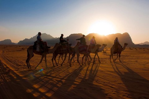 Tourist riding camels