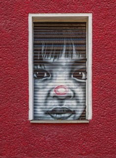 Creative graffiti with emotional statements on the facade of a youth psychiatrist's house