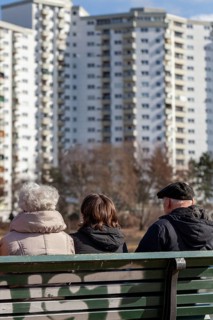 Seniors sitting on a park bench at the Segeluchbecken in the Maerkisches Viertel