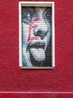 Creative graffiti with emotional statements on the facade of a youth psychiatrist's house