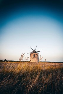The Old Windmill of Tes in the sunset with guests