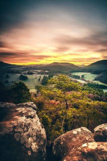 View from the sandstone rock Wachtfelsen to the sunrise