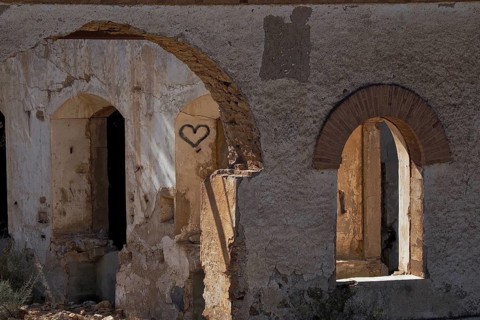 Abandoned house with round arches