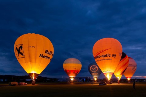 Hot air balloons on the ground during balloon lighting