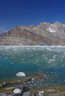 View of a fjord filled with drift ice
