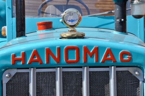 Hanomag logo with radiator figure on turquoise metal from tractor