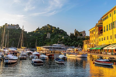 Boats anchored in the harbour of Portofino in the morning light