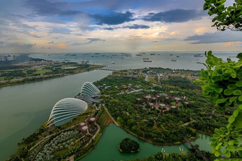 View from Marina Bay Sands to the Gardens by the Bay and the ships in front of the harbour