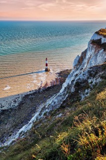 Red and white lighthouse in the sea