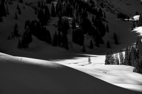 Two ski tourers in wintry mountain landscape