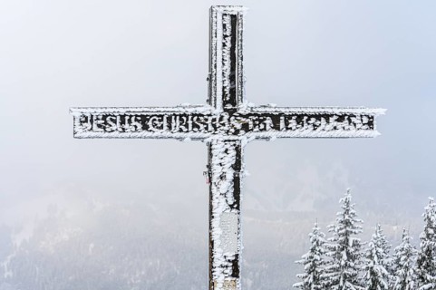 Snowy summit cross