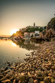 Historical village by the sea. Bay with harbour in the morning