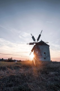 The Old Windmill of Tes in the sunset with guests