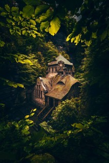 Old gasworks made of solid stone with stone steps in the middle of a gorge with forest and trees. Hrensko Czech Republic