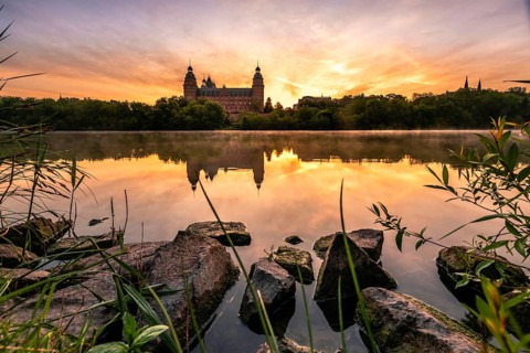 Johannisburg Castle reflected in the Main