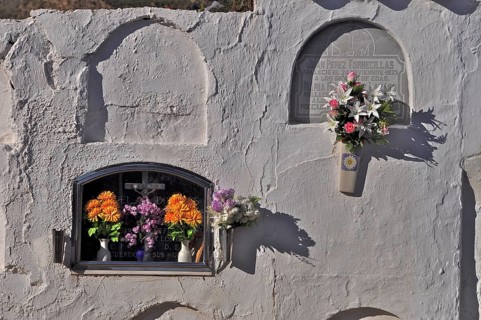 Graves with coffin niches in wall in a cemetery