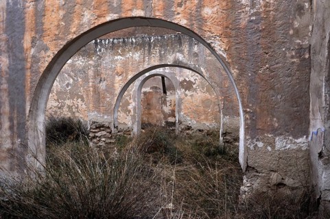 Abandoned house with round arches