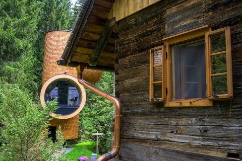 Old wooden house and modern forest house on the Pogusch