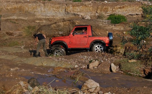 Stuck off-road vehicle in mud hole