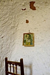 Picture on white wall with chair back