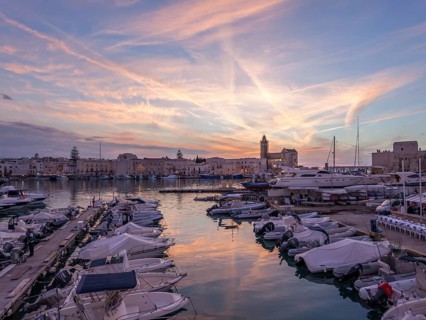 Sunset in the harbour of Trani