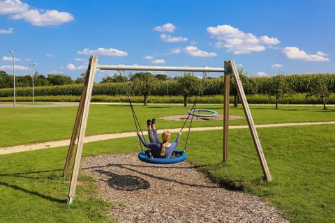 Woman on swing in the Garden of Eden