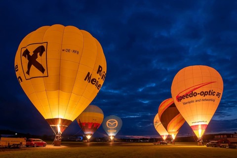 Hot air balloons on the ground during balloon lighting