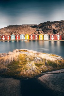 Boats and colourful boathouses in Smoegen Harbour